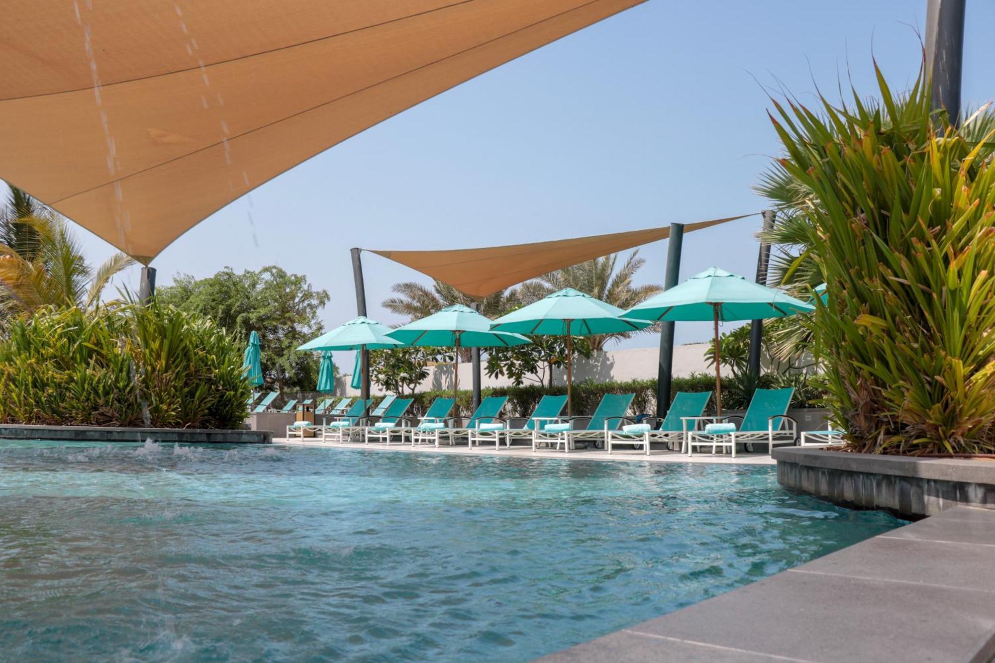 Bay La Sun Hotel And Marina - Emaar King Abdullah Economic City Dış mekan fotoğraf The swimming pool at the hotel