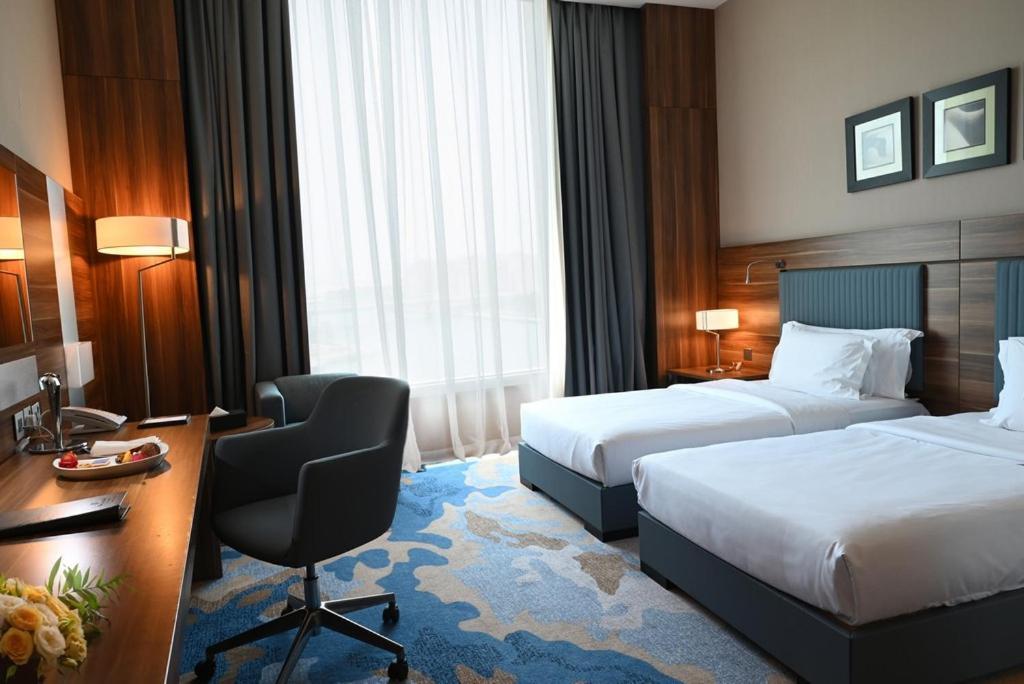 Bay La Sun Hotel And Marina - Emaar King Abdullah Economic City Dış mekan fotoğraf A room at the hotel