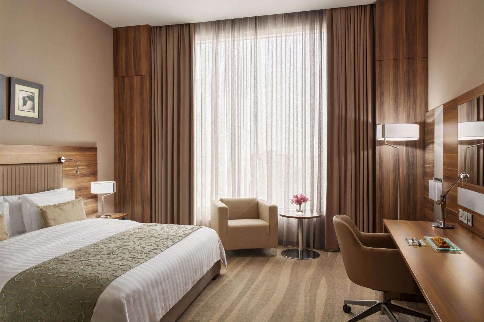 Bay La Sun Hotel And Marina - Emaar King Abdullah Economic City Dış mekan fotoğraf A room at the hotel